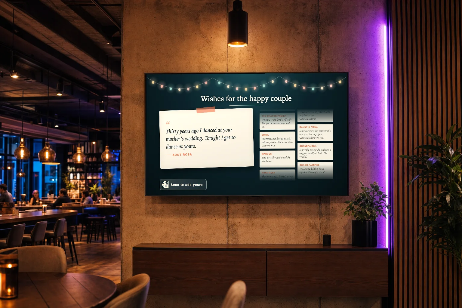 A restaurant at night with a wall TV showing a Wishes for the happy couple board, beside a glowing purple light strip